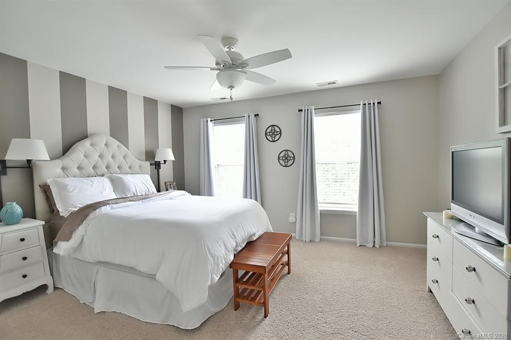 735 West Cheval Drive Fort Mill, SC 29708 - Photo 21 of 41 a bedroom with a bed and a flat screen tv