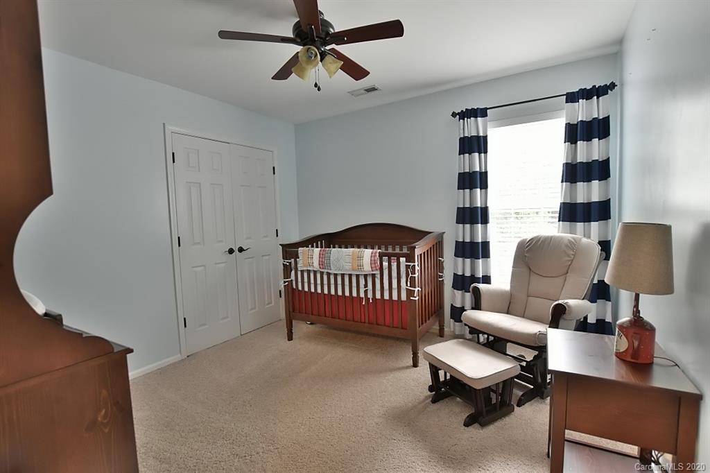 735 West Cheval Drive Fort Mill, SC 29708 - Photo 23 of 41 a bedroom with furniture and a large window