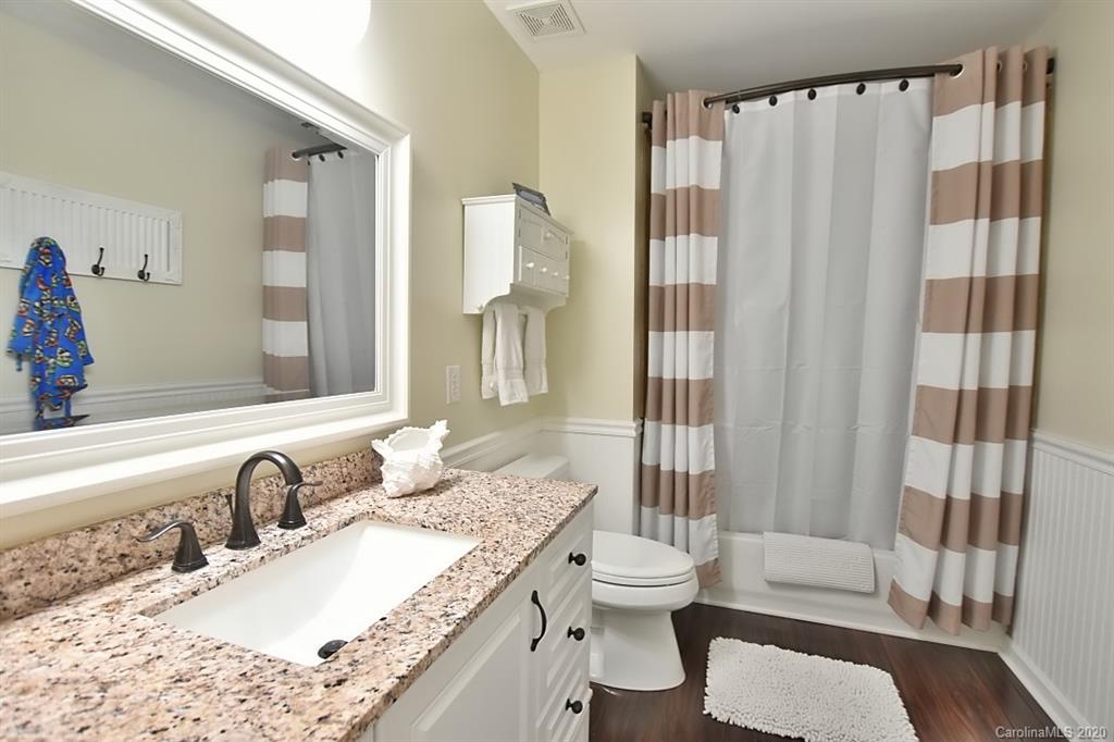 735 West Cheval Drive Fort Mill, SC 29708 - Photo 24 of 41 a bathroom with a granite countertop sink toilet and shower