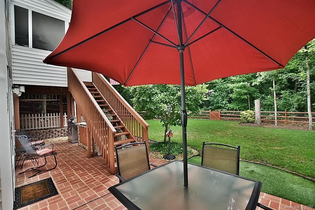 735 West Cheval Drive Fort Mill, SC 29708 - Photo 34 of 41 a backyard of a house with yard table and chairs