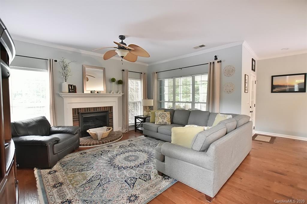 735 West Cheval Drive Fort Mill, SC 29708 - Photo 7 of 41 a living room with furniture and a fireplace