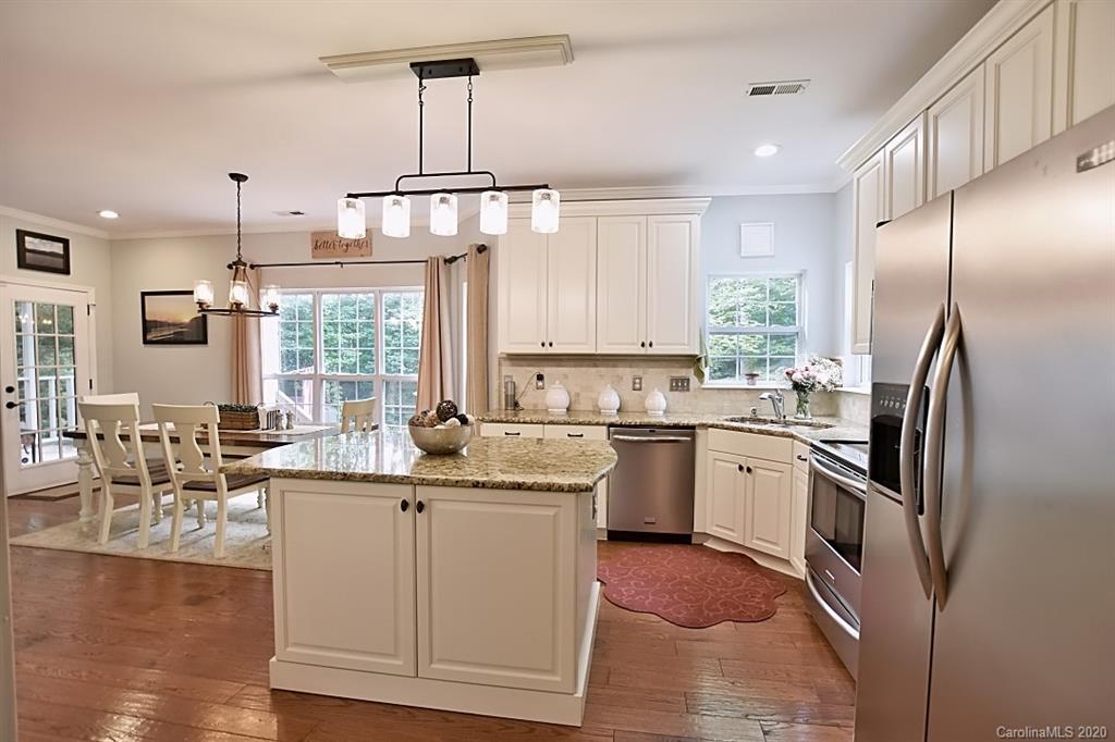 735 West Cheval Drive Fort Mill, SC 29708 - Photo 10 of 41 a kitchen with stainless steel appliances granite countertop a sink a stove and refrigerator