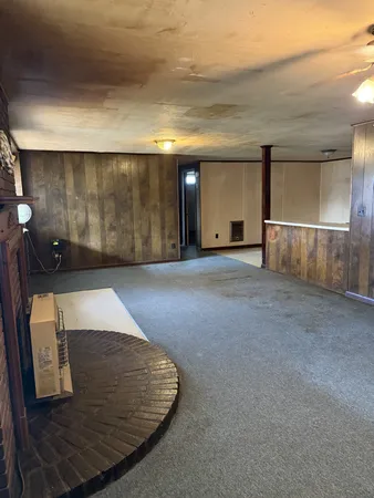 an empty room with wooden floor