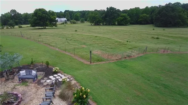 a view of a lake with a yard
