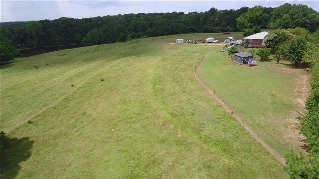 876 Simpson Mill Road Locust Grove, GA 30248 - Photo 15 of 40 a view of a lake with beach