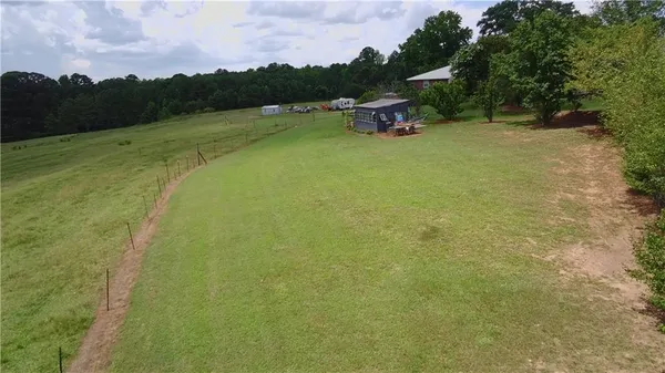 a backyard of a house with lots of green space