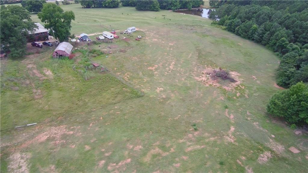 876 Simpson Mill Road Locust Grove, GA 30248 - Photo 17 of 40 a backyard of a house with lots of green space
