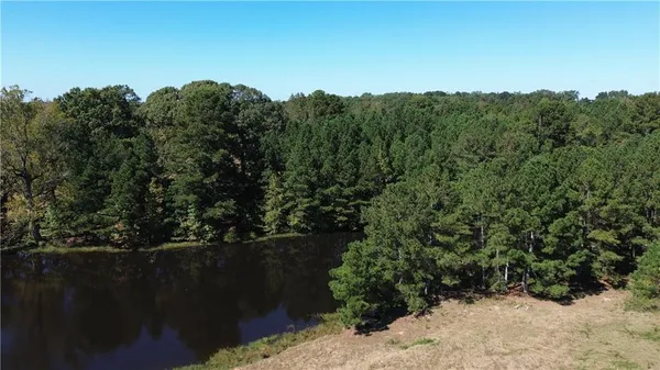 a view of a brick house with a yard