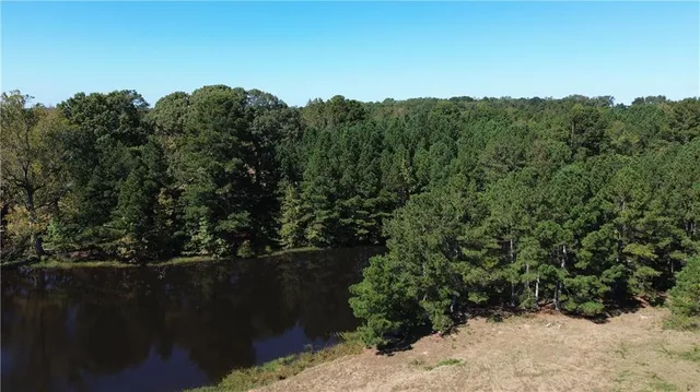a view of a porch with chairs and couches