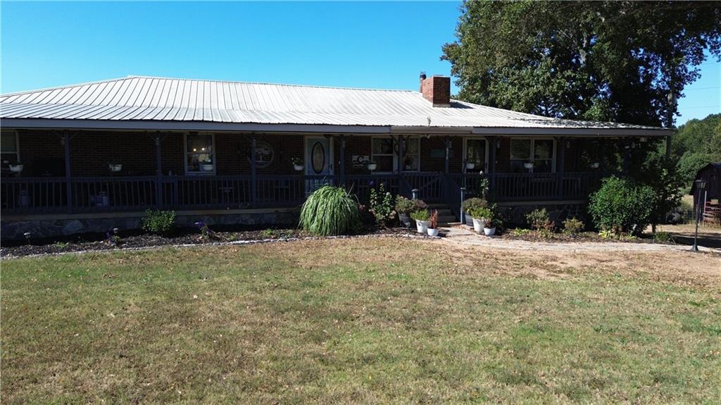 876 Simpson Mill Road Locust Grove, GA 30248 - Photo 30 of 40 a front view of a house with yard and parking