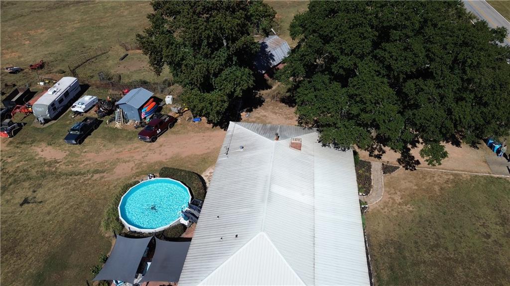 876 Simpson Mill Road Locust Grove, GA 30248 - Photo 32 of 40 an aerial view of a house with swimming pool and outdoor space