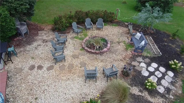 a kitchen with granite countertop a stove and a microwave