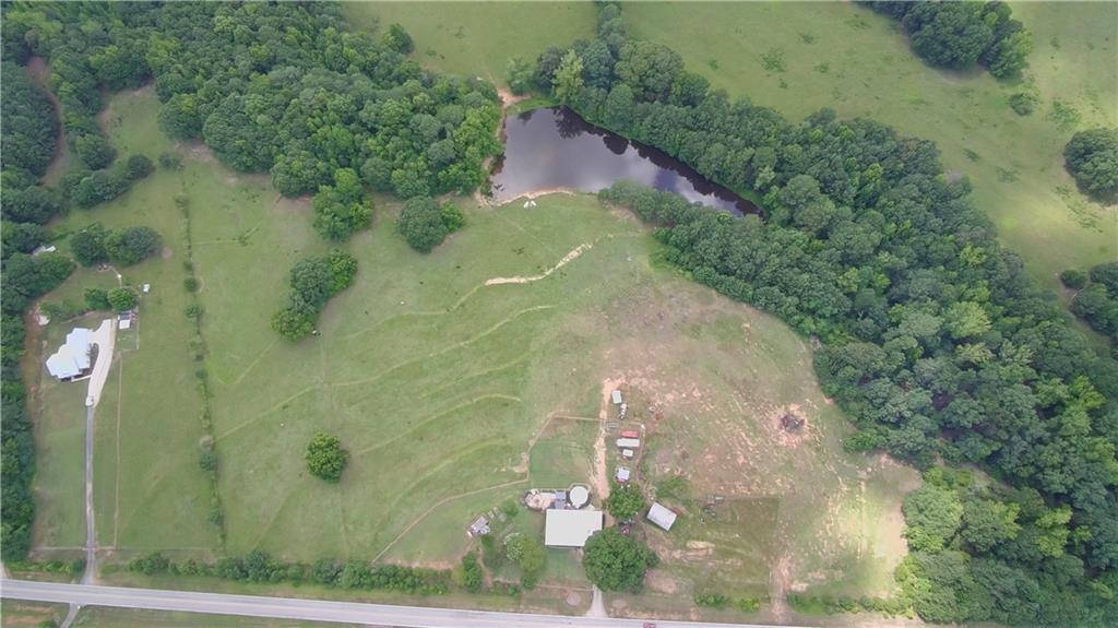 876 Simpson Mill Road Locust Grove, GA 30248 - Photo 10 of 40 an aerial view of a residential houses