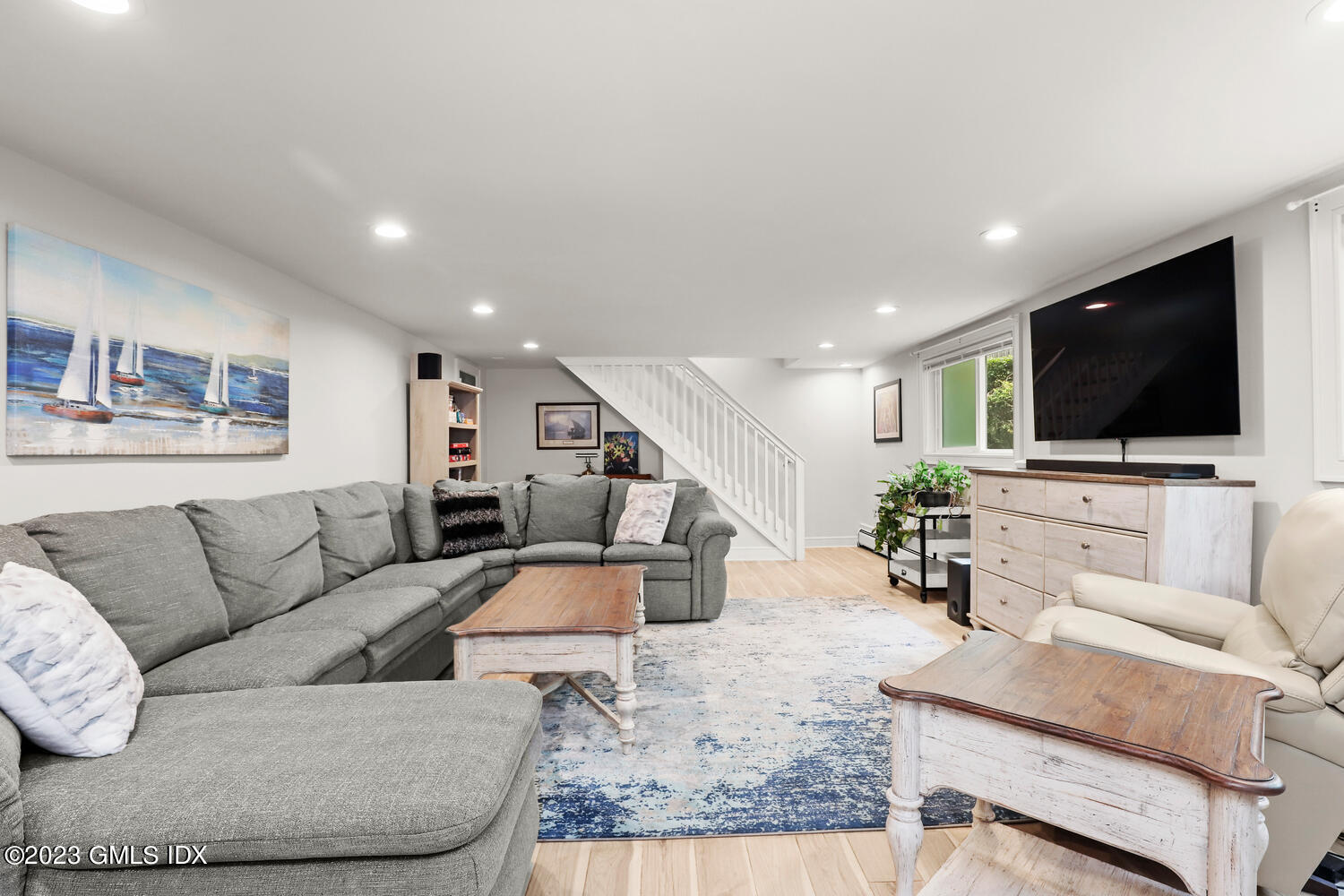 5 Oxer Place Greenwich, CT 06830 - Photo 26 of 37 a living room with furniture and a flat screen tv