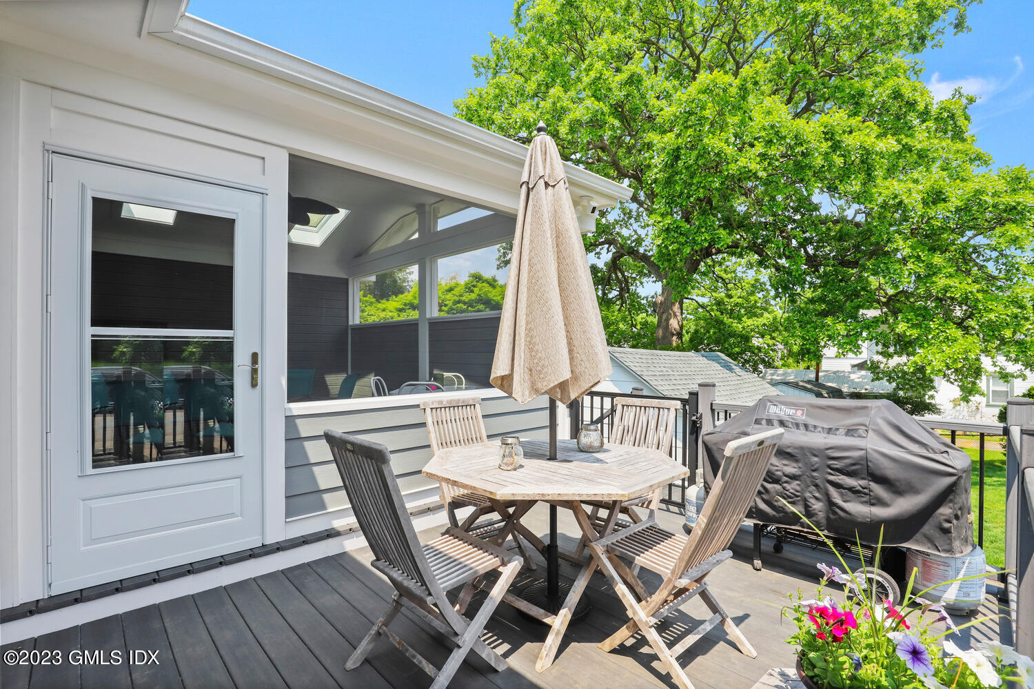 5 Oxer Place Greenwich, CT 06830 - Photo 28 of 37 a view of an outdoor sitting area with furniture and wooden floor