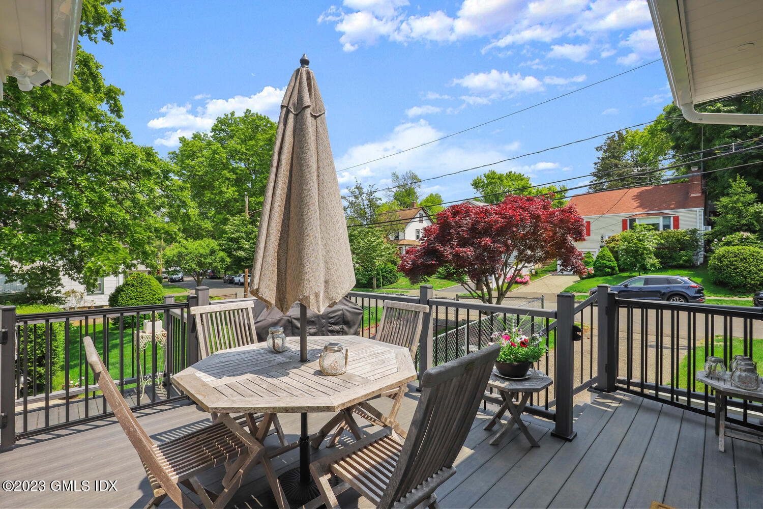5 Oxer Place Greenwich, CT 06830 - Photo 29 of 37 a view of a patio with a table chairs and a table