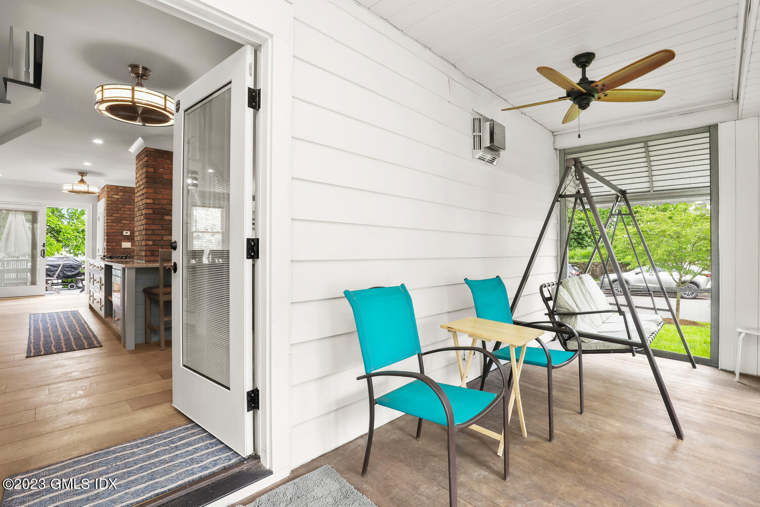 5 Oxer Place Greenwich, CT 06830 - Photo 3 of 37 a view of a hallway with furniture and a floor to ceiling window