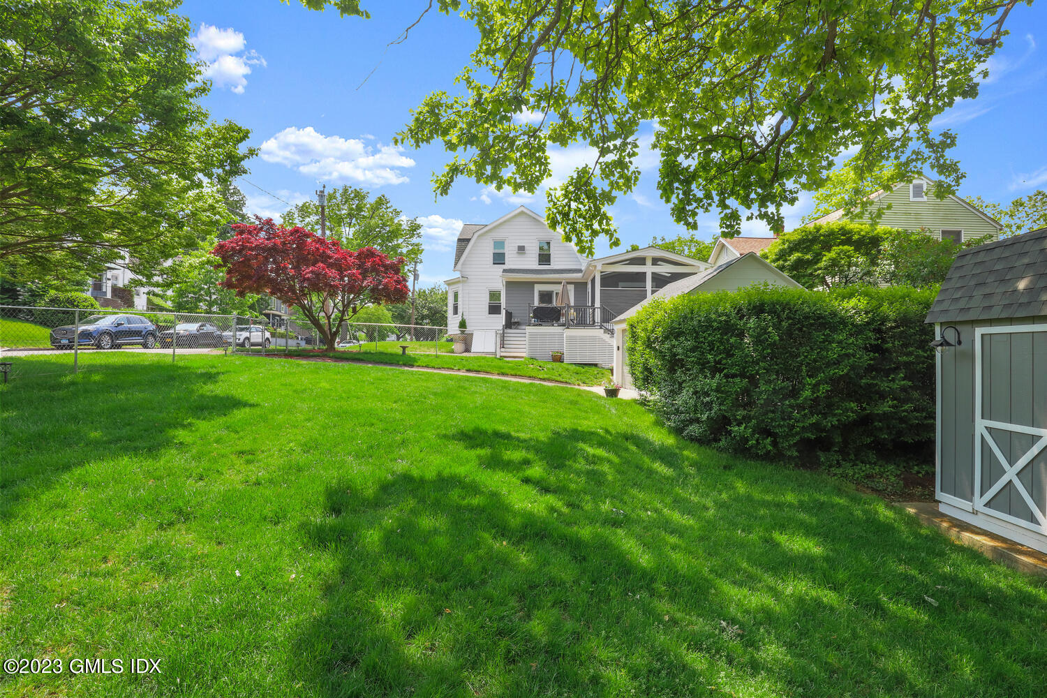 5 Oxer Place Greenwich, CT 06830 - Photo 31 of 37 a front view of a house with garden