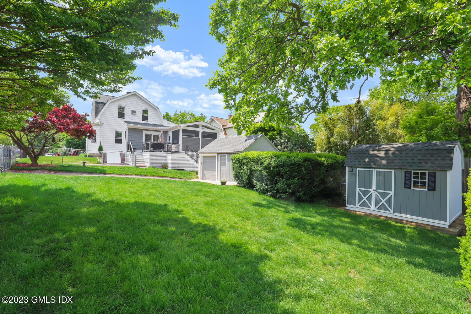 5 Oxer Place Greenwich, CT 06830 - Photo 32 of 37 a front view of house with yard and green space