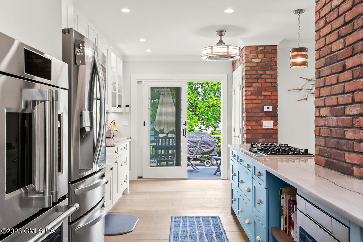 5 Oxer Place Greenwich, CT 06830 - Photo 5 of 37 a kitchen with stainless steel appliances a refrigerator and a stove