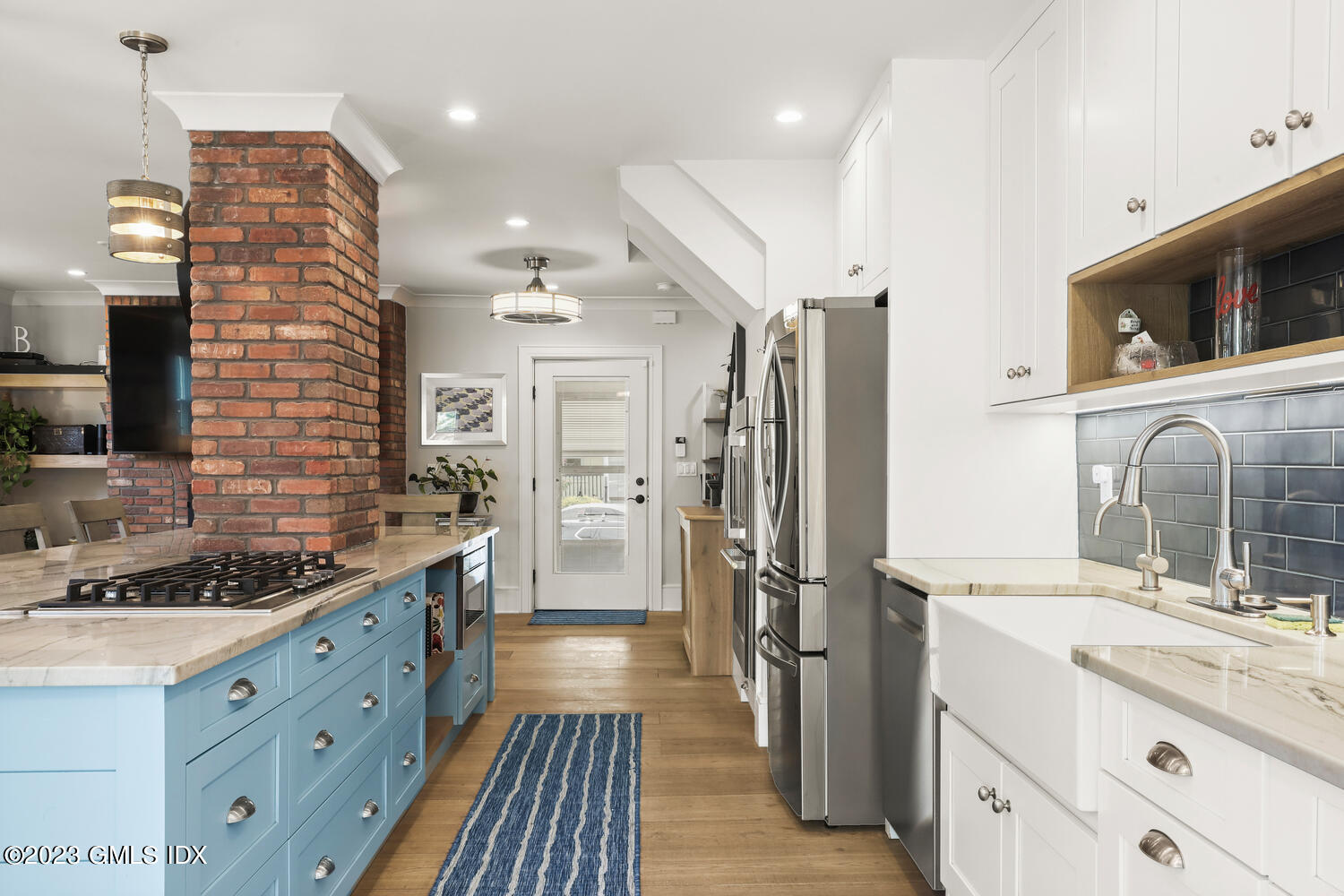 5 Oxer Place Greenwich, CT 06830 - Photo 6 of 37 a kitchen with stainless steel appliances a sink stove and refrigerator