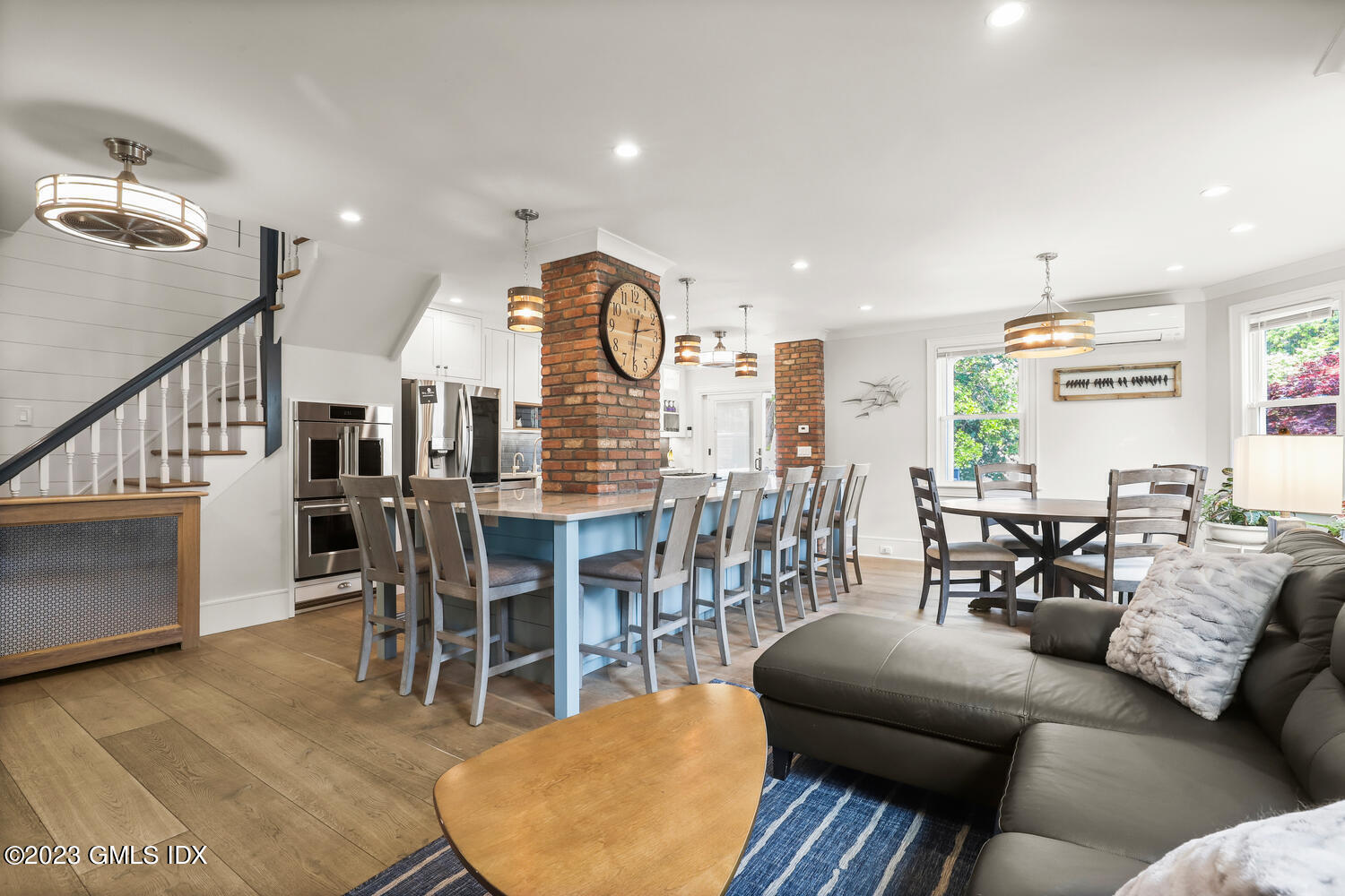 5 Oxer Place Greenwich, CT 06830 - Photo 9 of 37 a living room with furniture a dining table and a large window