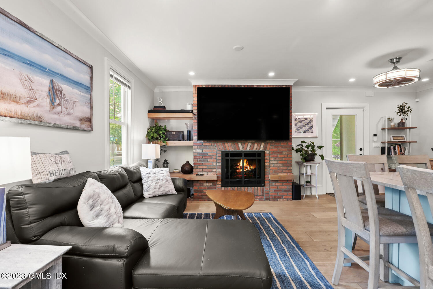 5 Oxer Place Greenwich, CT 06830 - Photo 10 of 37 a living room with furniture a flat screen tv and a fireplace