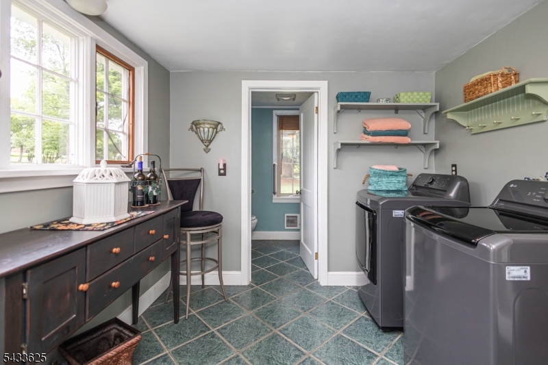 449 Stamets Road Milford, NJ 08848 - Photo 22 of 44 a kitchen with stainless steel appliances granite countertop a stove a sink and a refrigerator