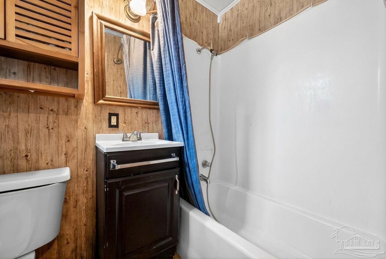 6253 Allentown Road Milton, FL 32570 - Photo 12 of 31 a bathroom with a sink a toilet and shower