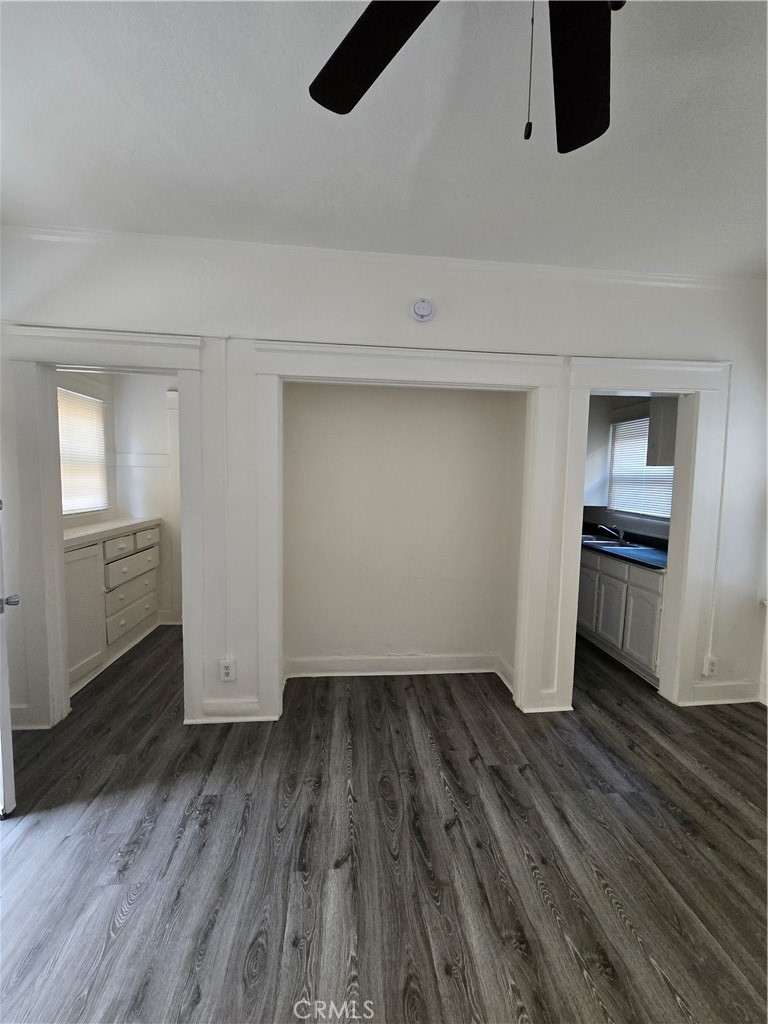 551 West 10th Street, Unit 3 Long Beach, CA 90813 - Photo 12 of 22 a view of empty room with wooden floor and cabinets