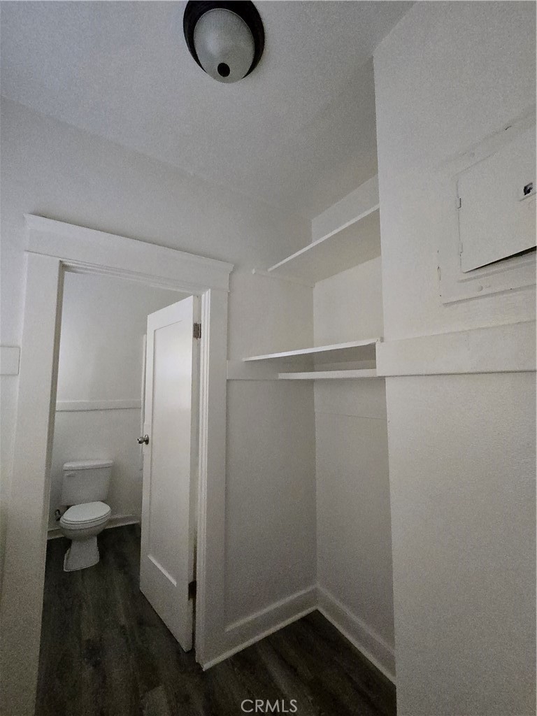 551 West 10th Street, Unit 3 Long Beach, CA 90813 - Photo 14 of 22 a bathroom with a granite countertop toilet and a sink