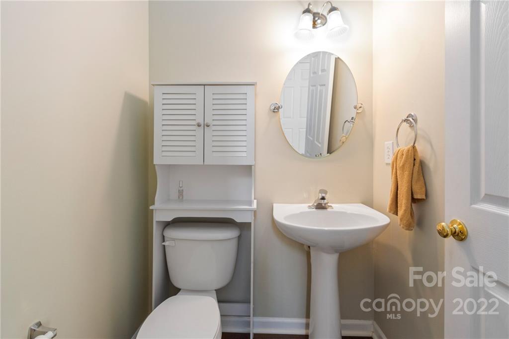 4905 Missi Lane Fort Mill, SC 29708 - Photo 18 of 34 a bathroom with a toilet sink and mirror