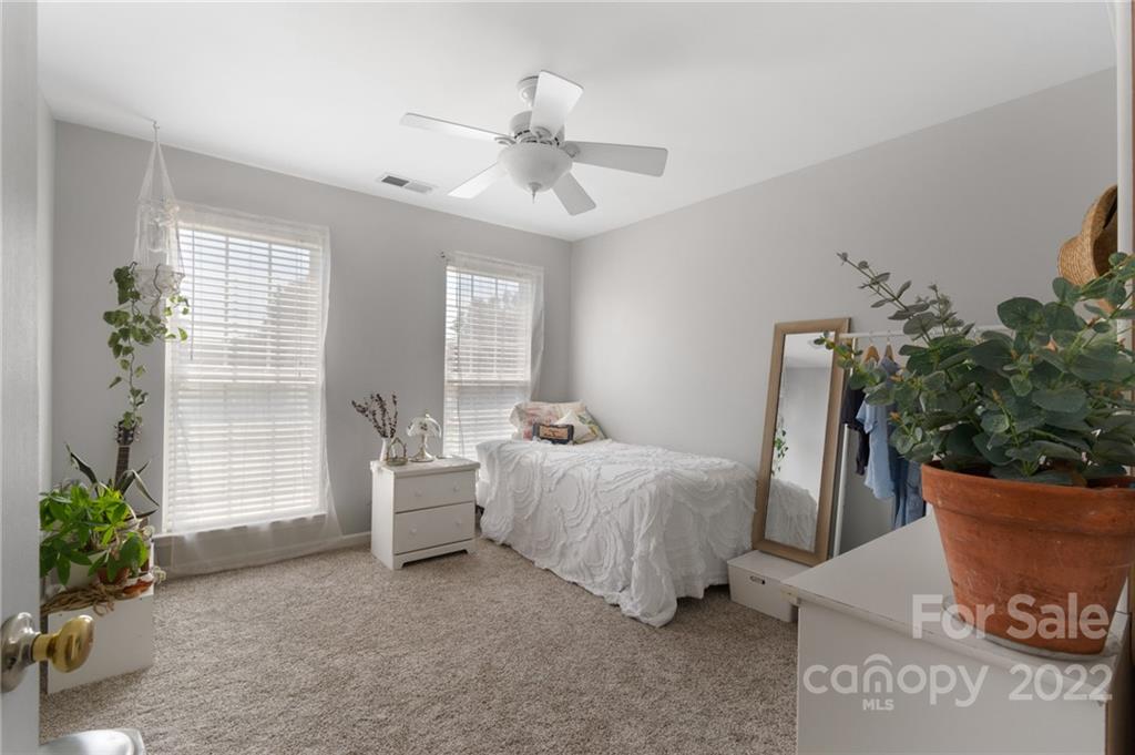 4905 Missi Lane Fort Mill, SC 29708 - Photo 20 of 34 a bed room with a bed and a potted plant