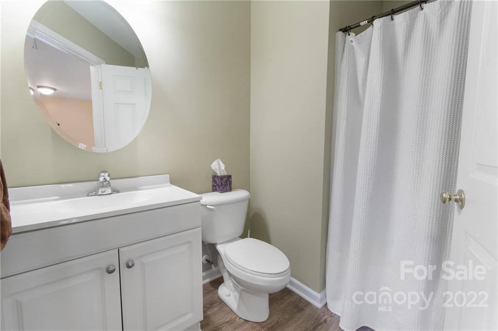 4905 Missi Lane Fort Mill, SC 29708 - Photo 21 of 34 a bathroom with a toilet a sink and a mirror