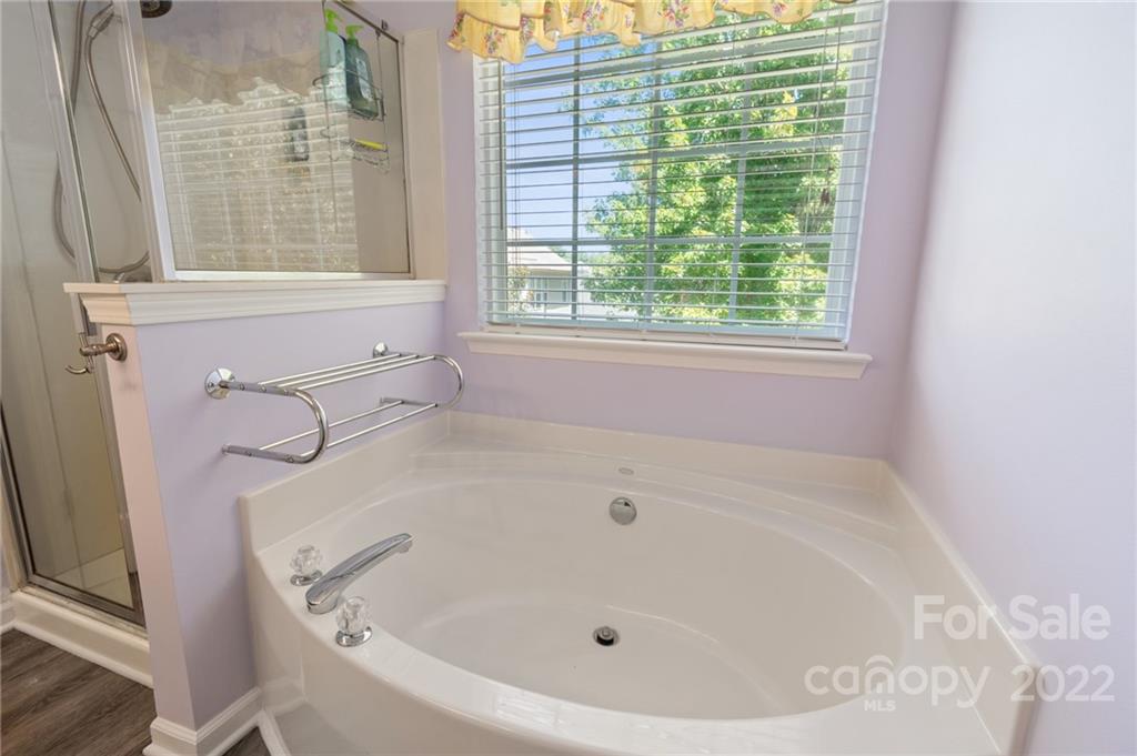 4905 Missi Lane Fort Mill, SC 29708 - Photo 24 of 34 a white bath tub sitting next to a window