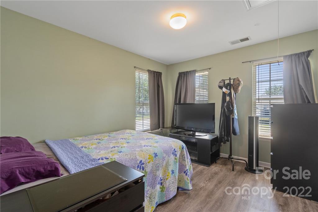 4905 Missi Lane Fort Mill, SC 29708 - Photo 25 of 34 a bedroom with a bed and a flat screen tv