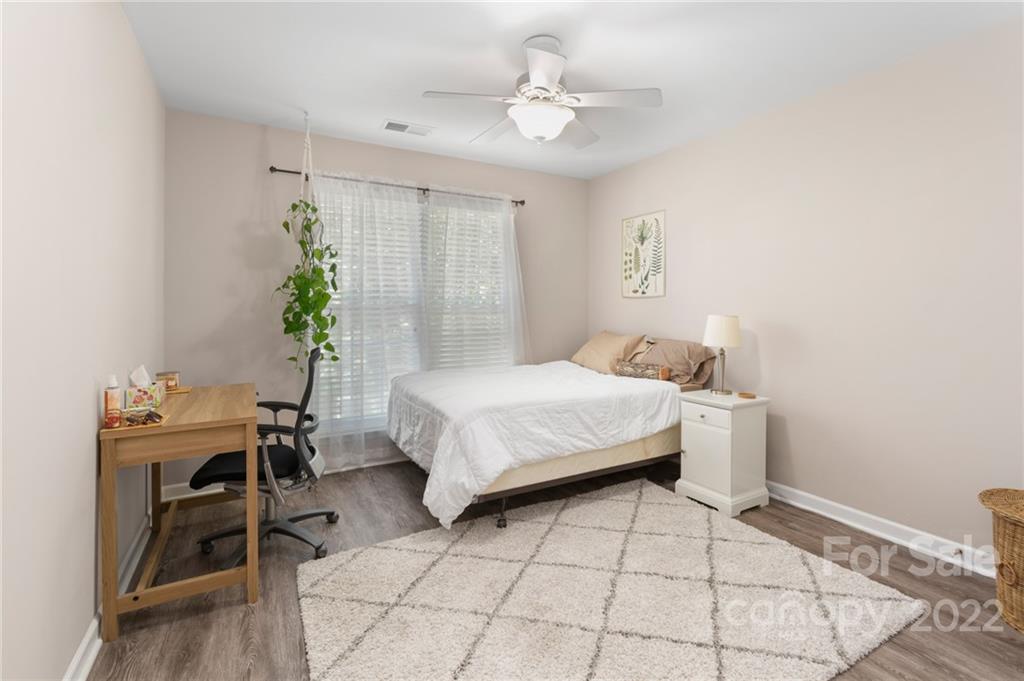 4905 Missi Lane Fort Mill, SC 29708 - Photo 26 of 34 a bedroom with a bed and a chair