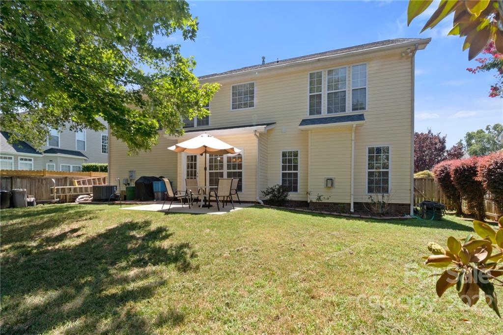 4905 Missi Lane Fort Mill, SC 29708 - Photo 29 of 34 a view of a house with a yard and potted plants