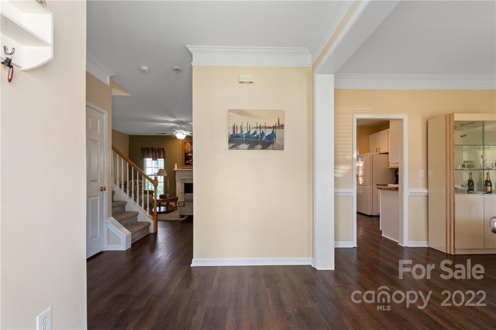4905 Missi Lane Fort Mill, SC 29708 - Photo 4 of 34 a view of a hallway with wooden floor and a living room