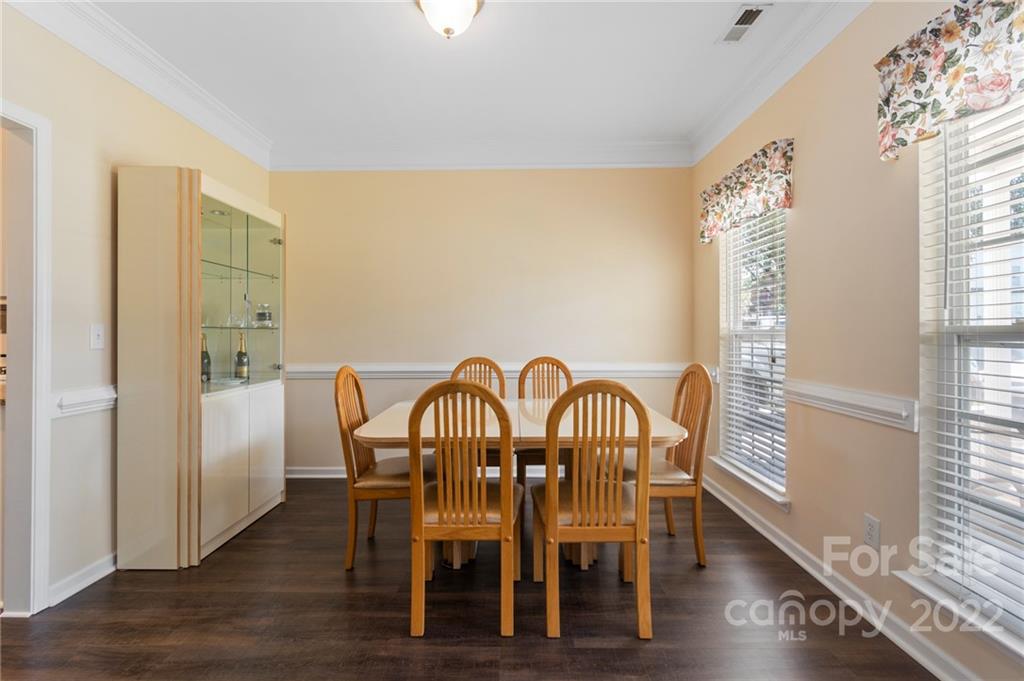 4905 Missi Lane Fort Mill, SC 29708 - Photo 5 of 34 a view of a dining room with furniture window and wooden floor
