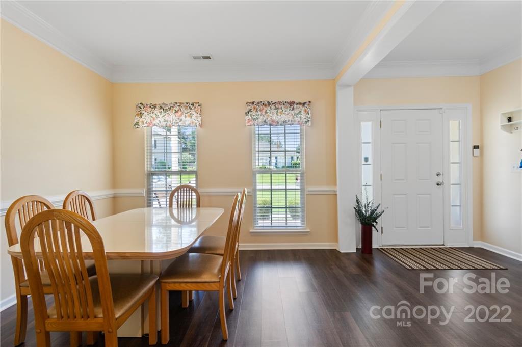 4905 Missi Lane Fort Mill, SC 29708 - Photo 6 of 34 a view of a a dining room with furniture window and wooden floor
