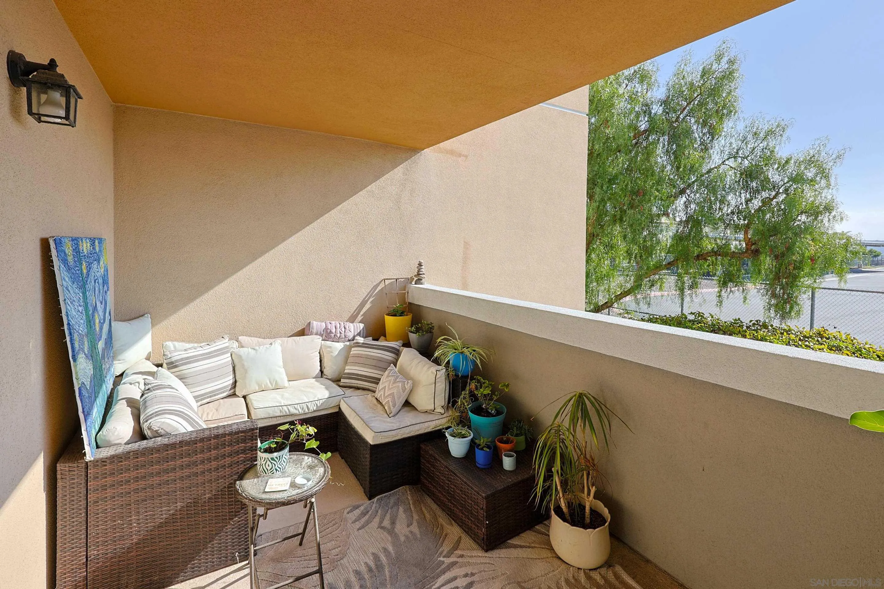 3887 Pell Place, Unit 229 San Diego, CA 92130 - Photo 16 of 49 a couple of table and chairs in the balcony