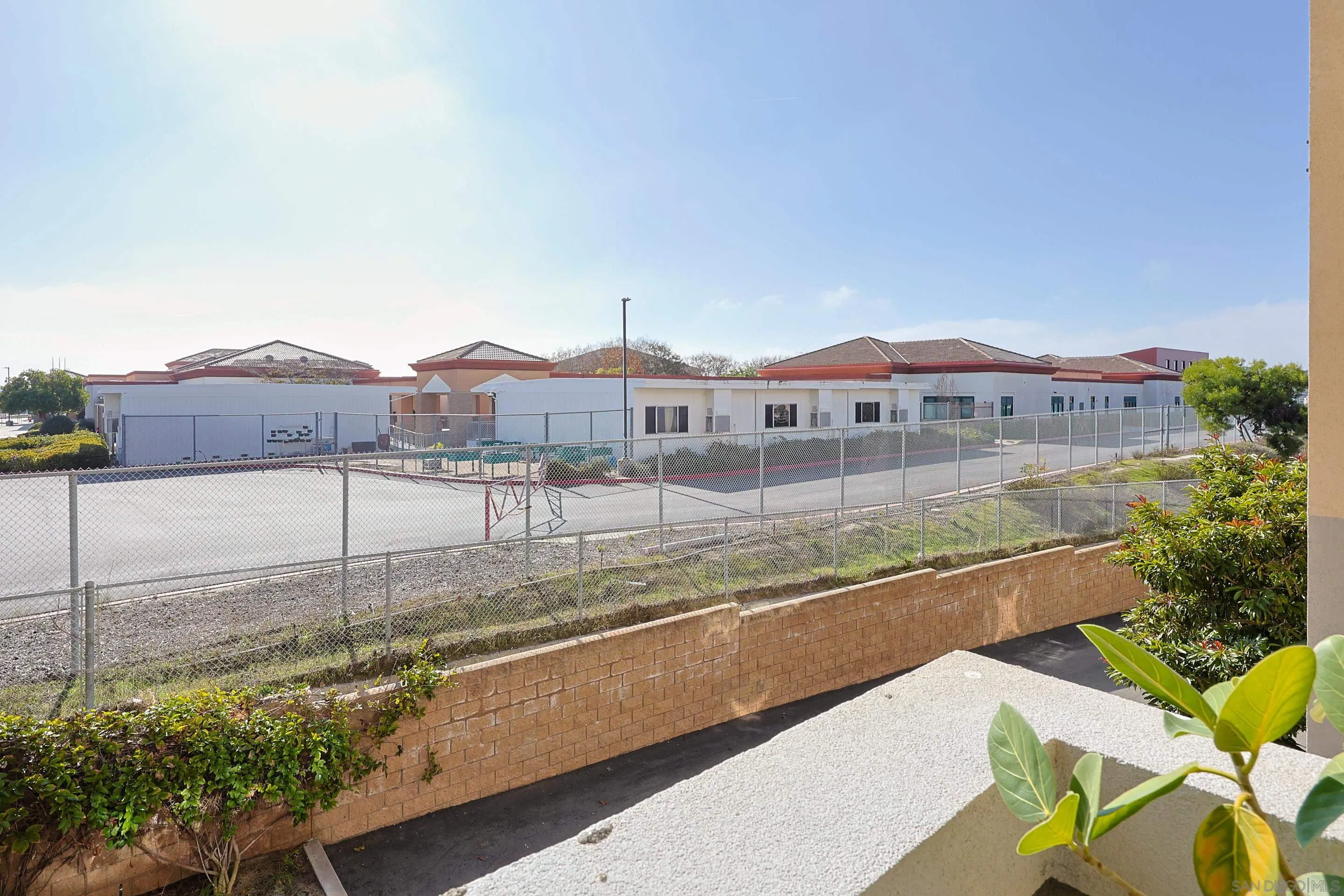 3887 Pell Place, Unit 229 San Diego, CA 92130 - Photo 22 of 49 a view of a house with a yard and sitting area