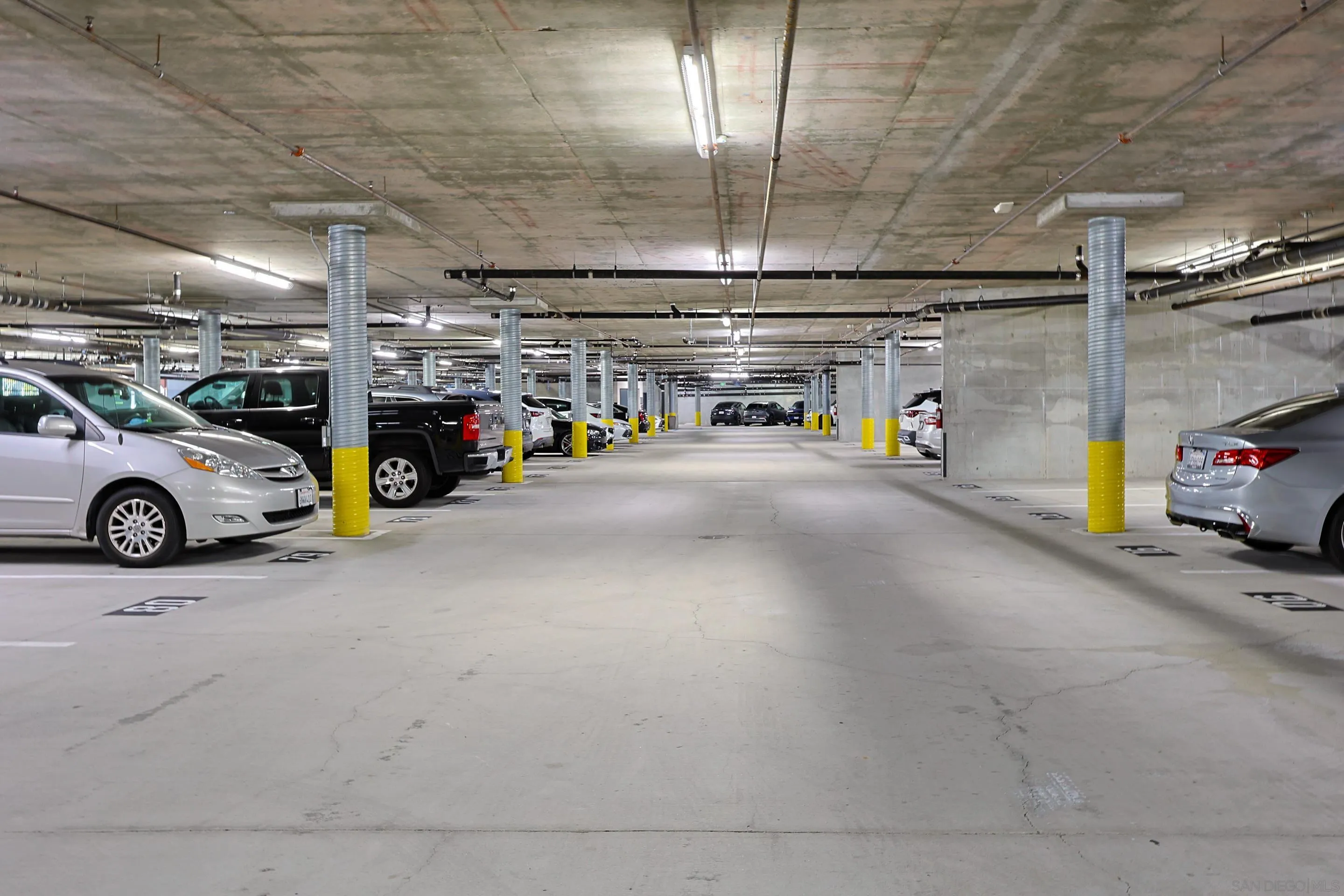 3887 Pell Place, Unit 229 San Diego, CA 92130 - Photo 23 of 49 a view of parking garage with cars