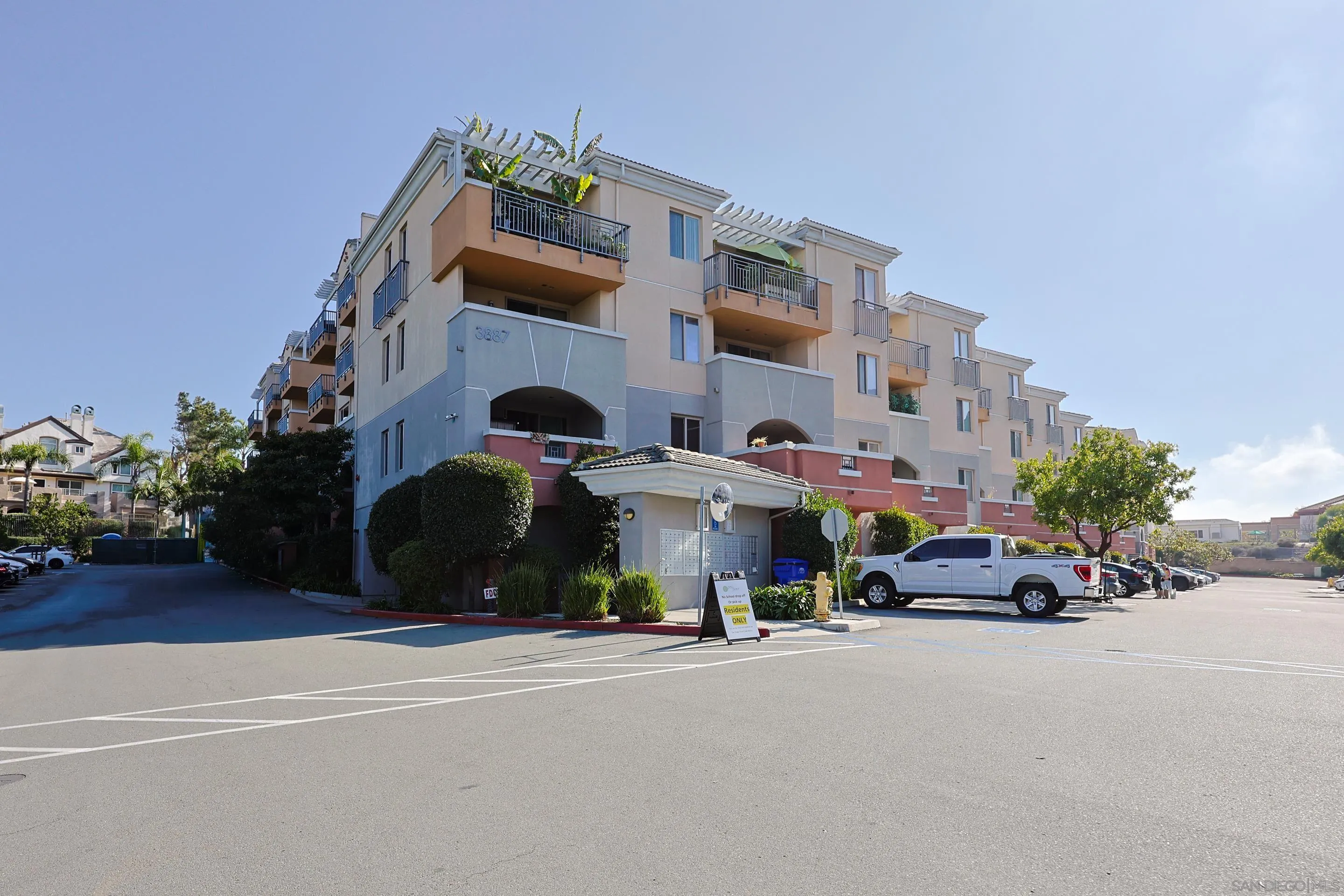 3887 Pell Place, Unit 229 San Diego, CA 92130 - Photo 26 of 49 a couple of cars parked in front of a building