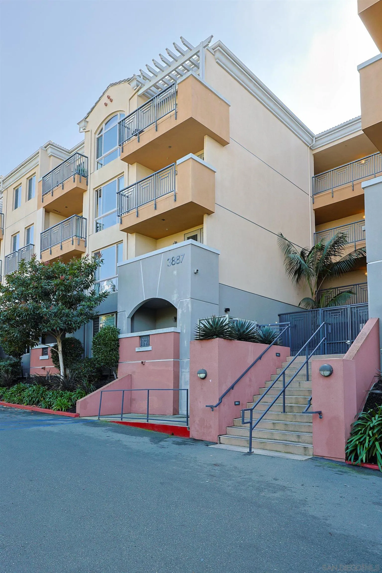 3887 Pell Place, Unit 229 San Diego, CA 92130 - Photo 27 of 49 a front view of a building with street