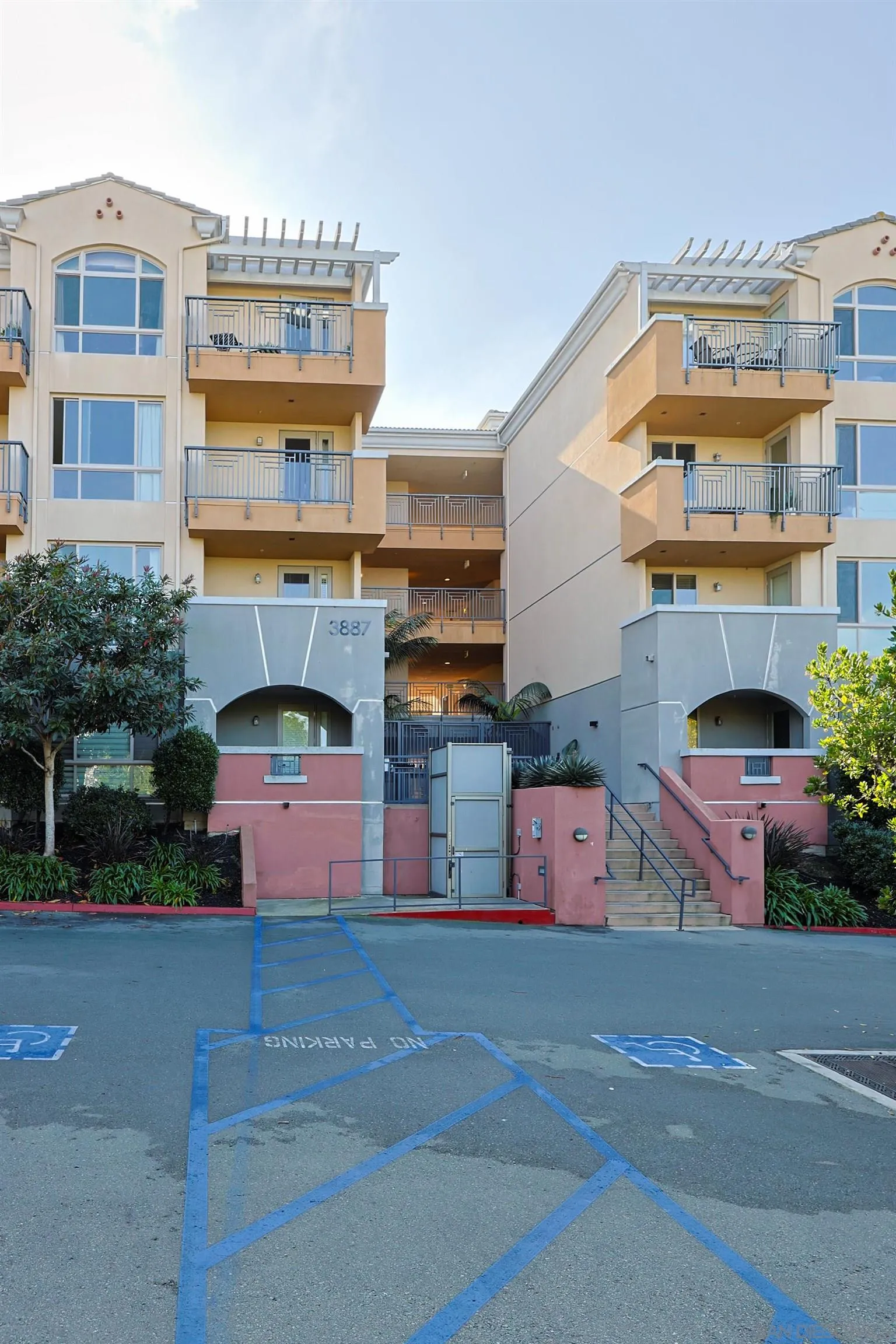 3887 Pell Place, Unit 229 San Diego, CA 92130 - Photo 29 of 49 a front view of a building with street