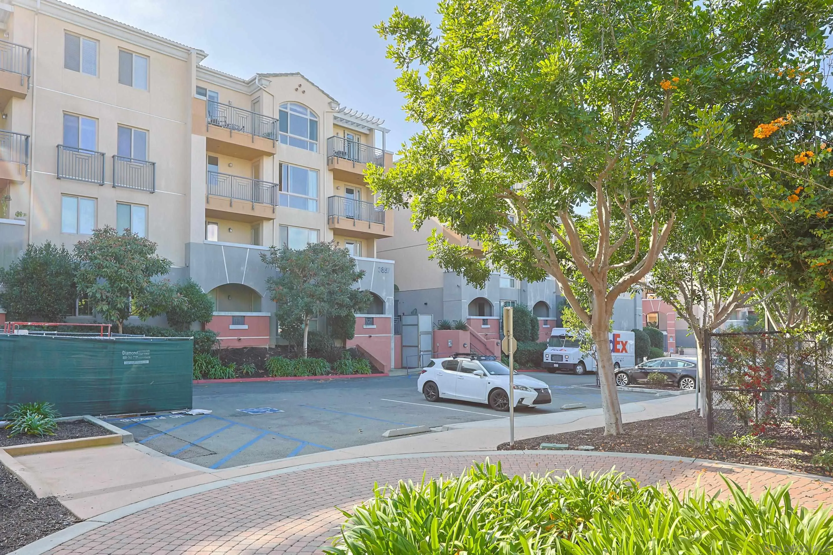 3887 Pell Place, Unit 229 San Diego, CA 92130 - Photo 30 of 49 a view of a building with garden and trees
