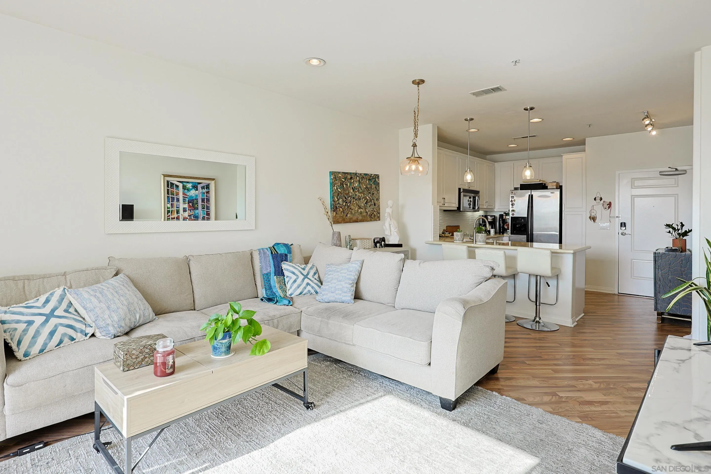 3887 Pell Place, Unit 229 San Diego, CA 92130 - Photo 3 of 49 a living room with furniture and view of kitchen