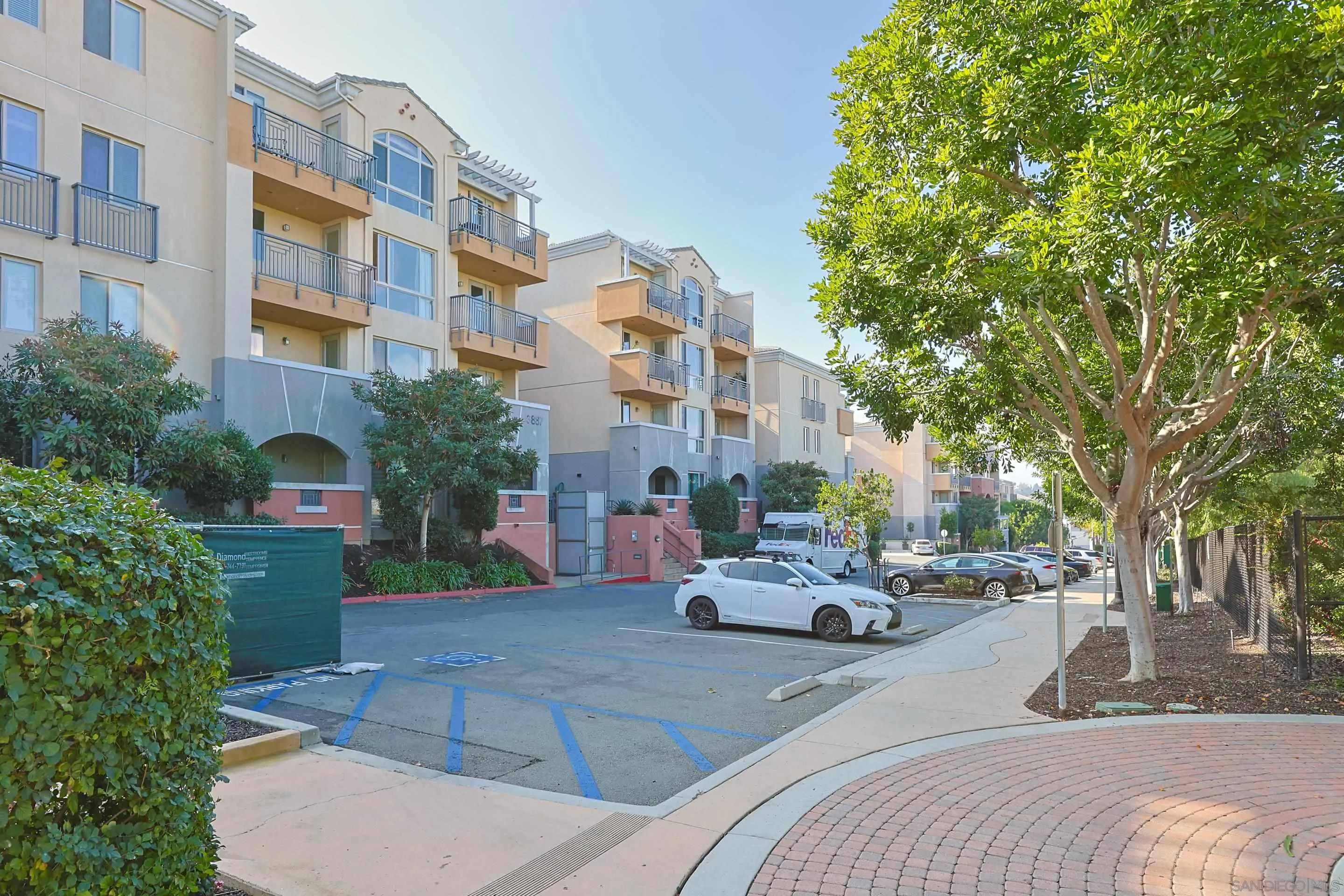 3887 Pell Place, Unit 229 San Diego, CA 92130 - Photo 31 of 49 a building exterior with parked car